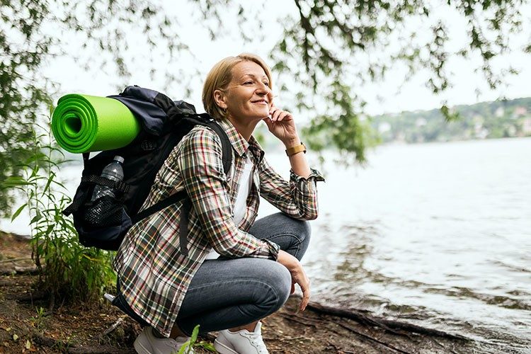 stock-photo-woman-hiking-near-lake-trauma-surgery